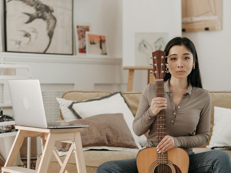 Person sitting comfortably in a bright room practicing relaxation
